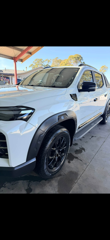 White dual-cab ute after a full detail